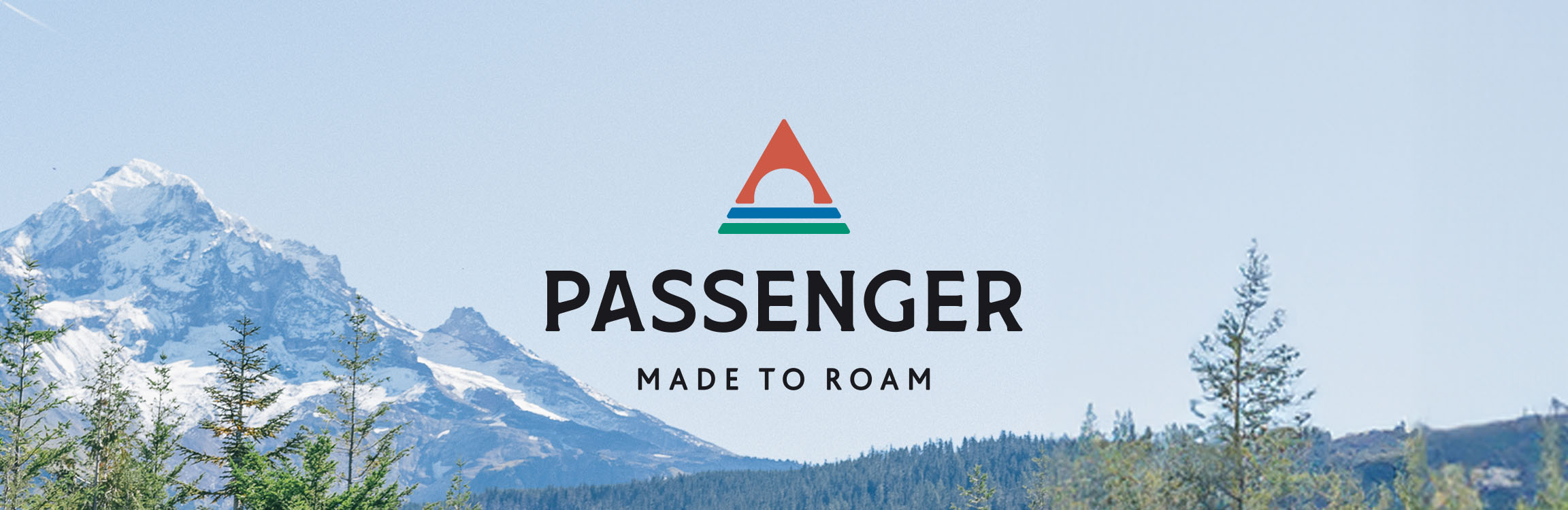 Passenger header image with the logo over a backdrop of mountains