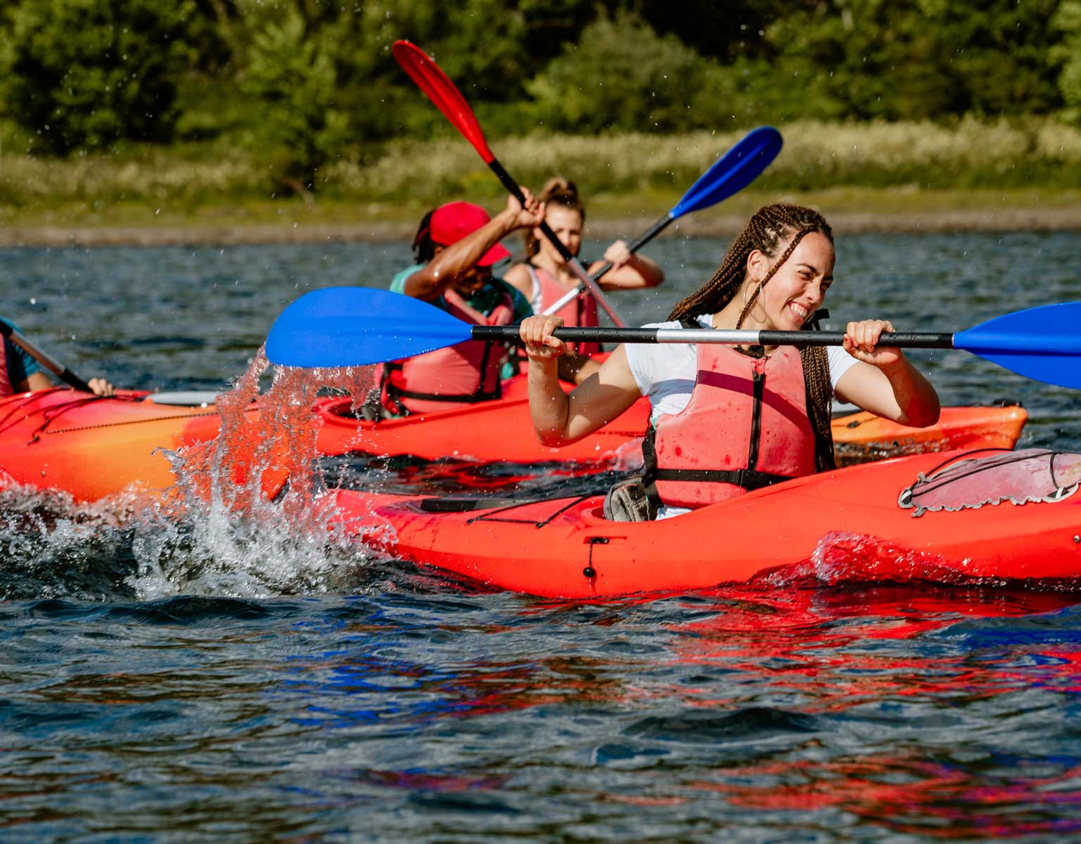 A few people are kayaking