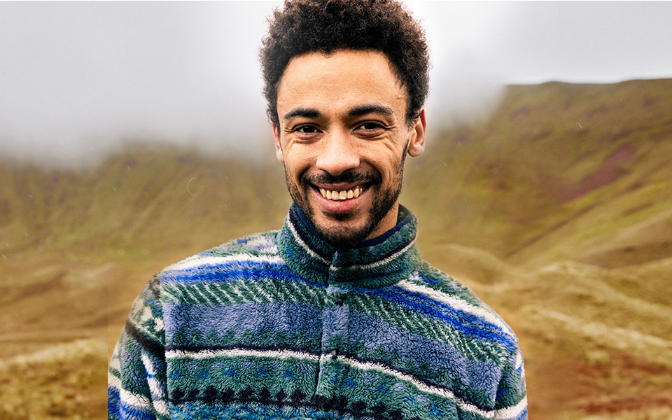 Ayacucho men's. A man smiling wearing an Ayacucho fleece 