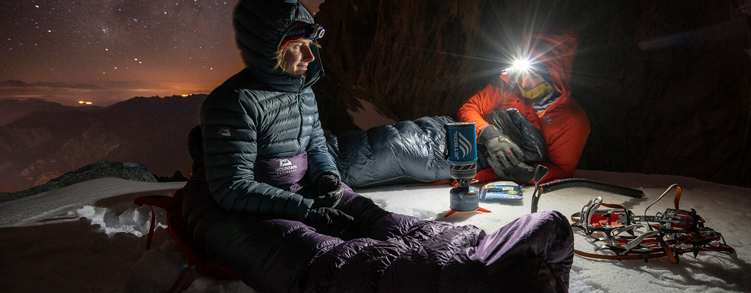 People camping in the snow with Mountain Equipment 