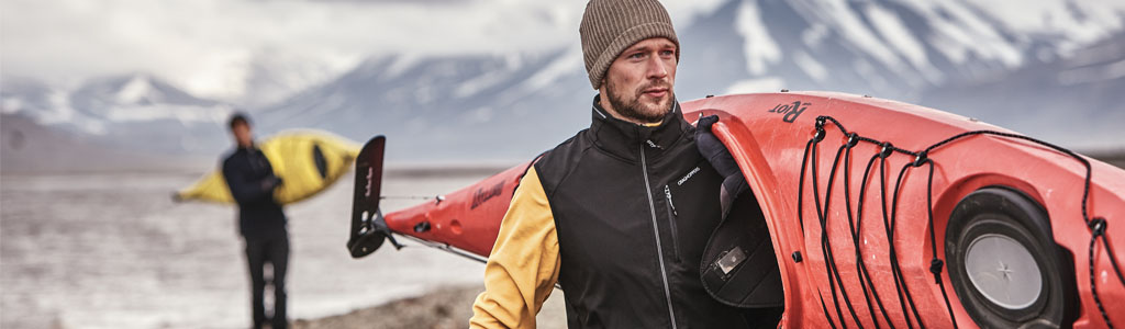 man holding a kayak