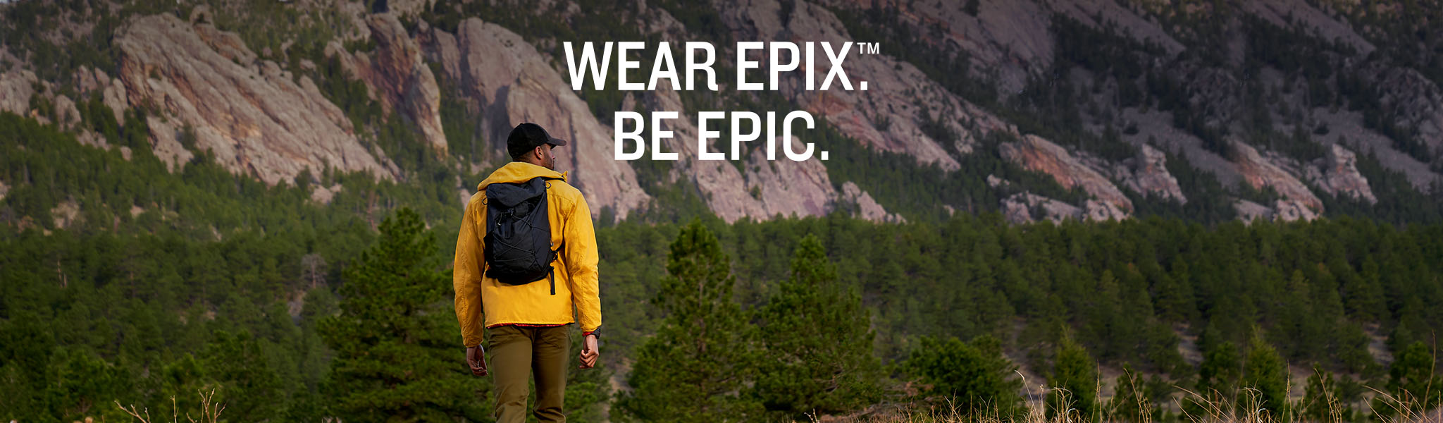 A man in the mountains wearing Garmin Epix 