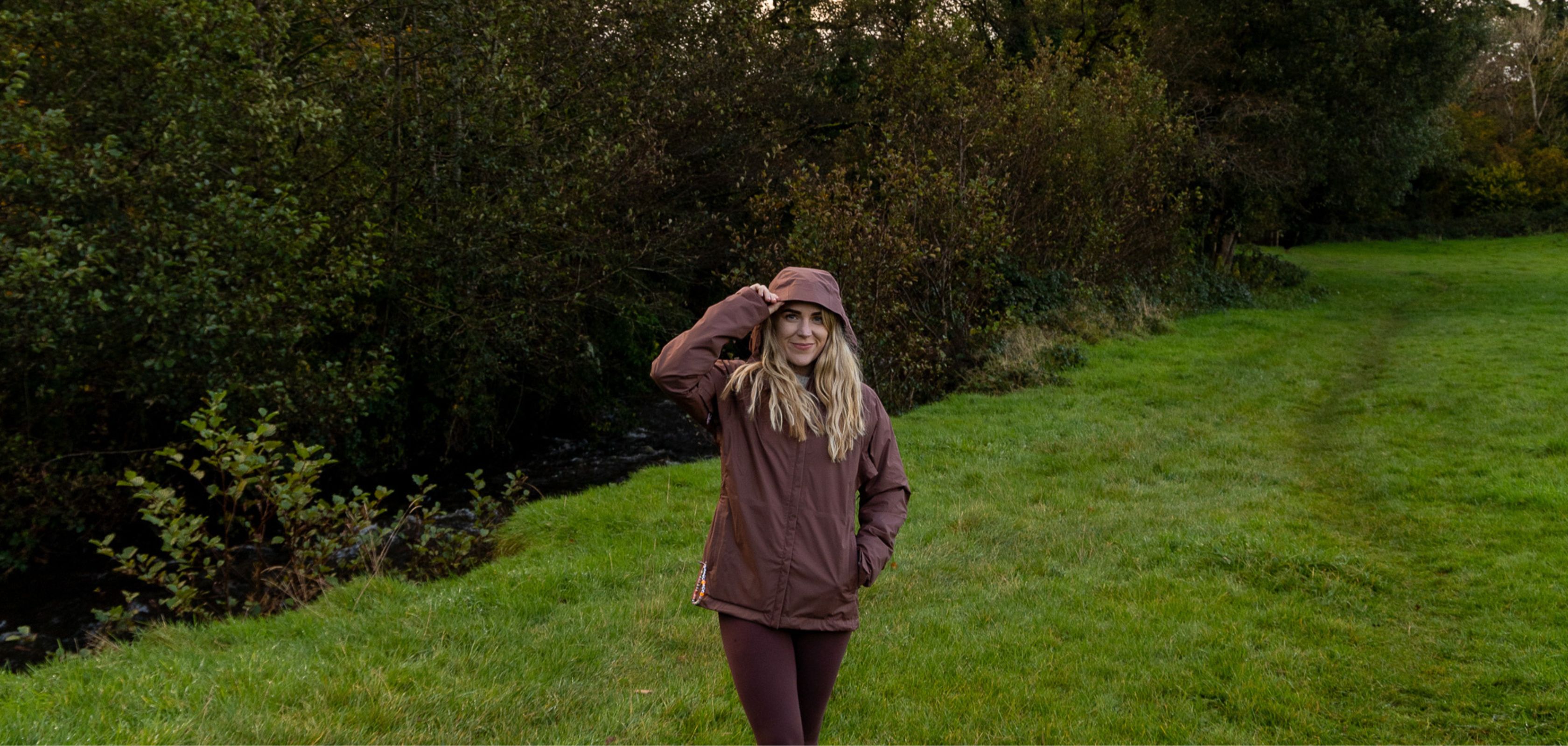 A girl in the countryside wearing a Patagonia jacket