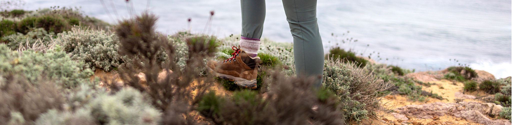 Close up of footwear on a grassy terrain