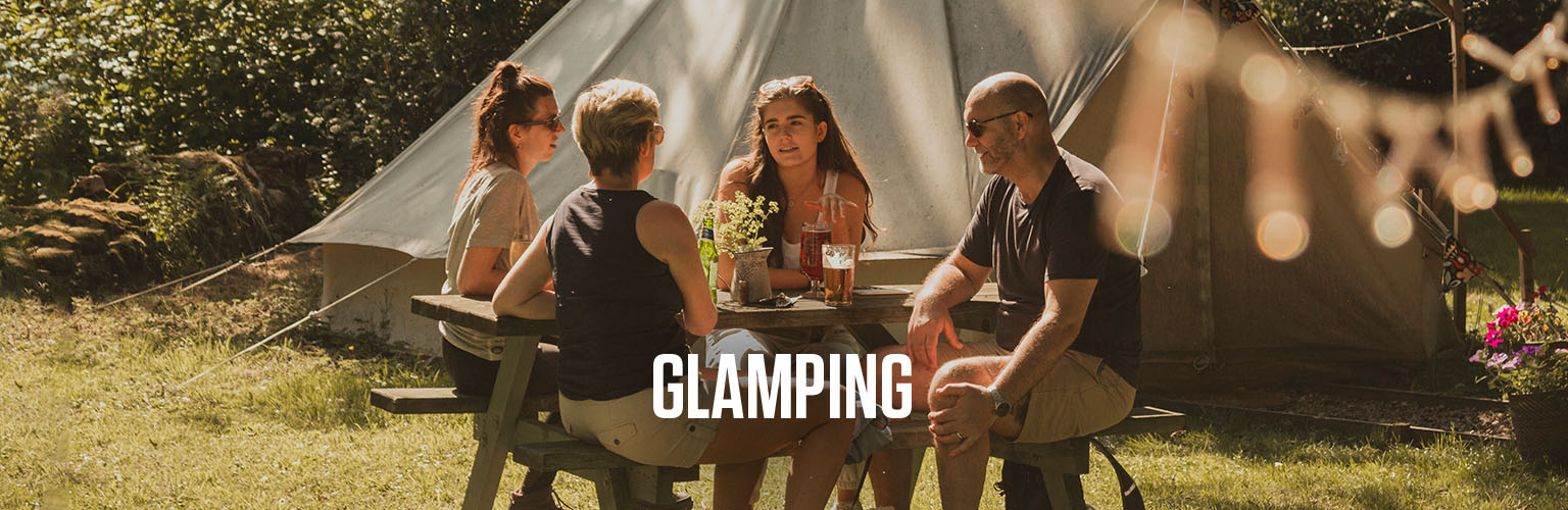 People camping, eating outdoors