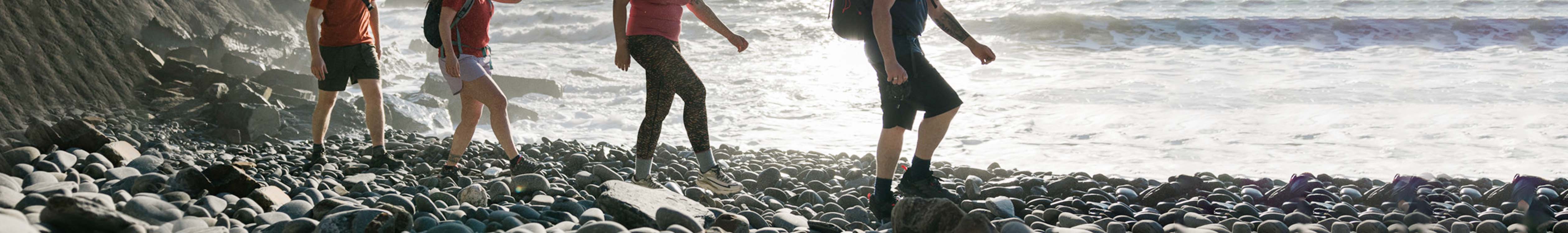 People walking near the ocean