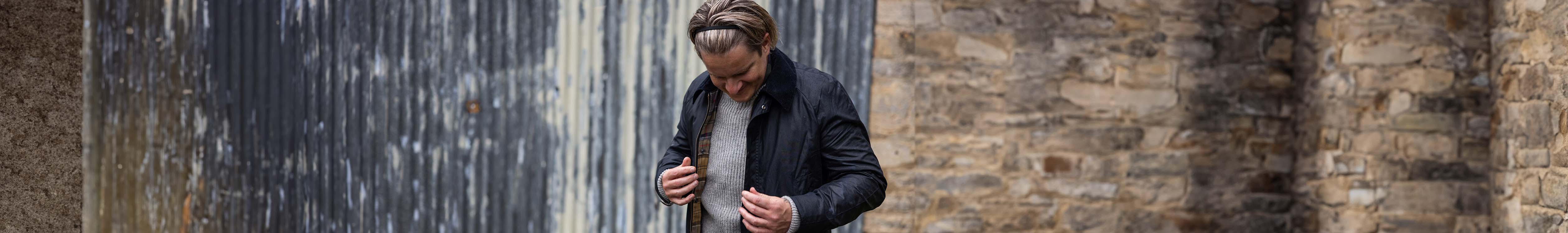 Man putting on a jacket