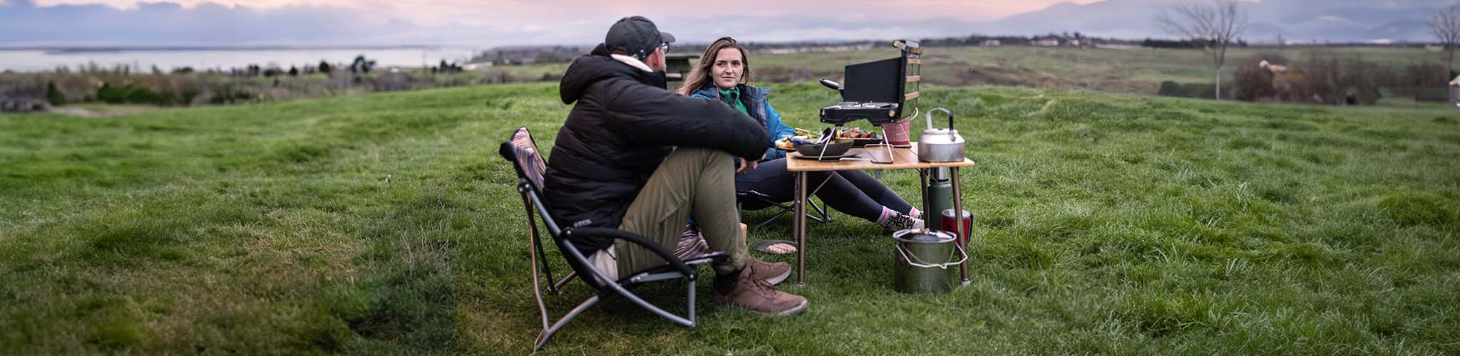 Persons using camp furniture