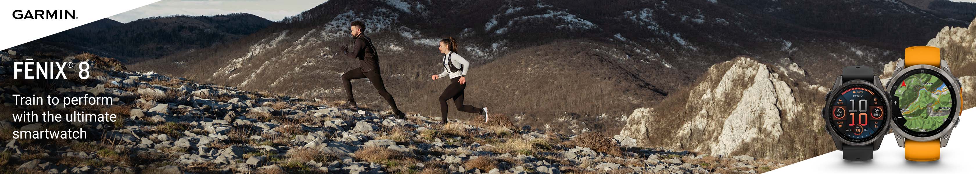 Persons running on a rocky land scape