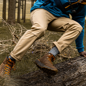 Person jumping over a log