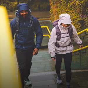 Persons walking in the rain