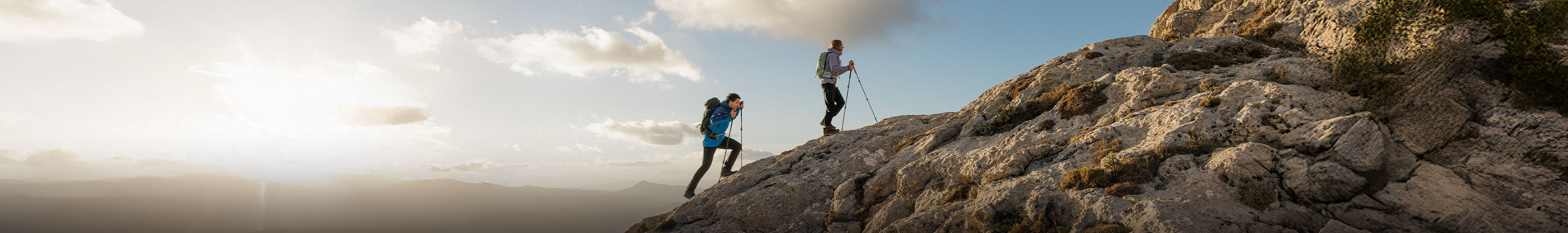 People hiking in the outdoors with packs