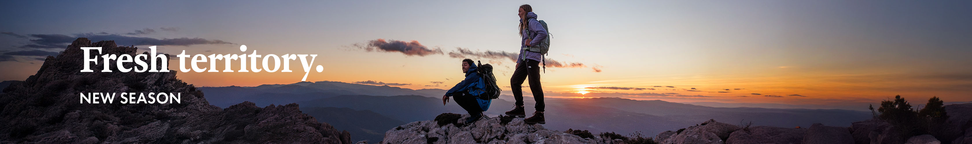 Fresh Territory. New Season. Man and Woman on mountain