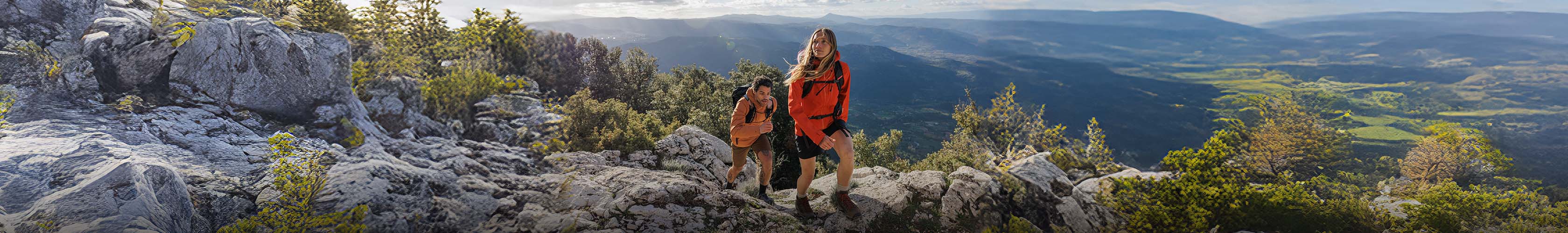 Man and woman walking in the mountains