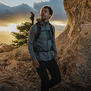 Man wearing a fleece walking in the outdoors