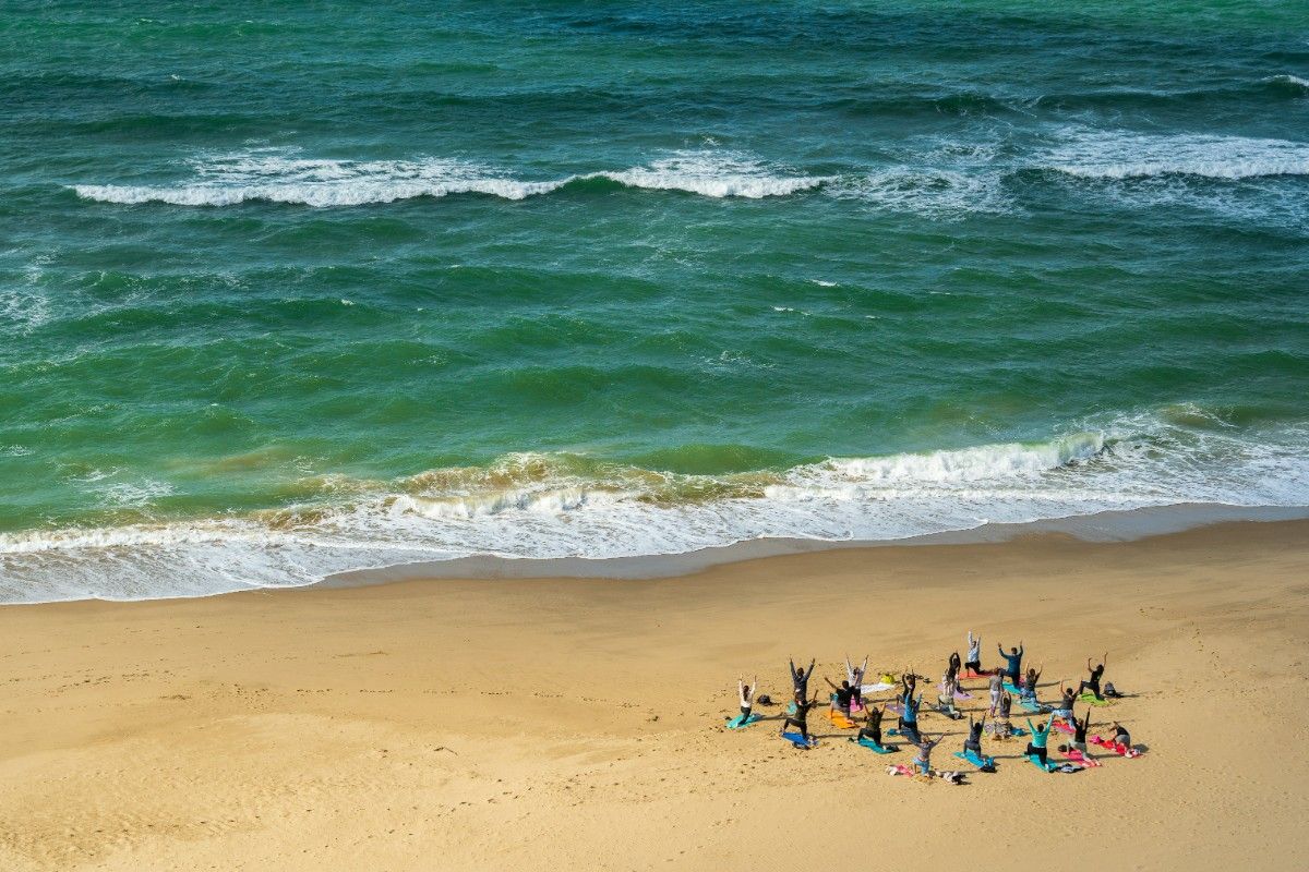 People doing yoga on Bournemouth Beach 