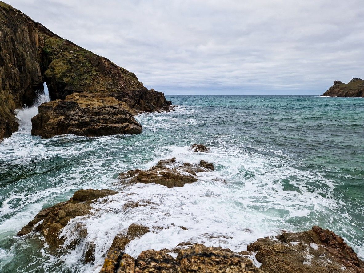 The waves crashing on the rocks at Nanjizal beach