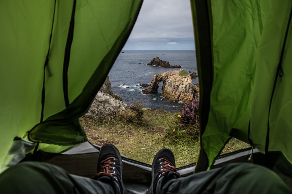 A man wild camping in Cornwall 