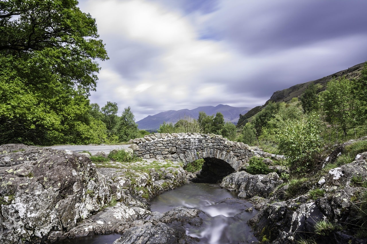 An image of a bridge over a stream in the Lake District 