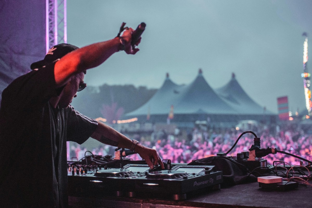 A DJ playing to a crowd at Coachella 