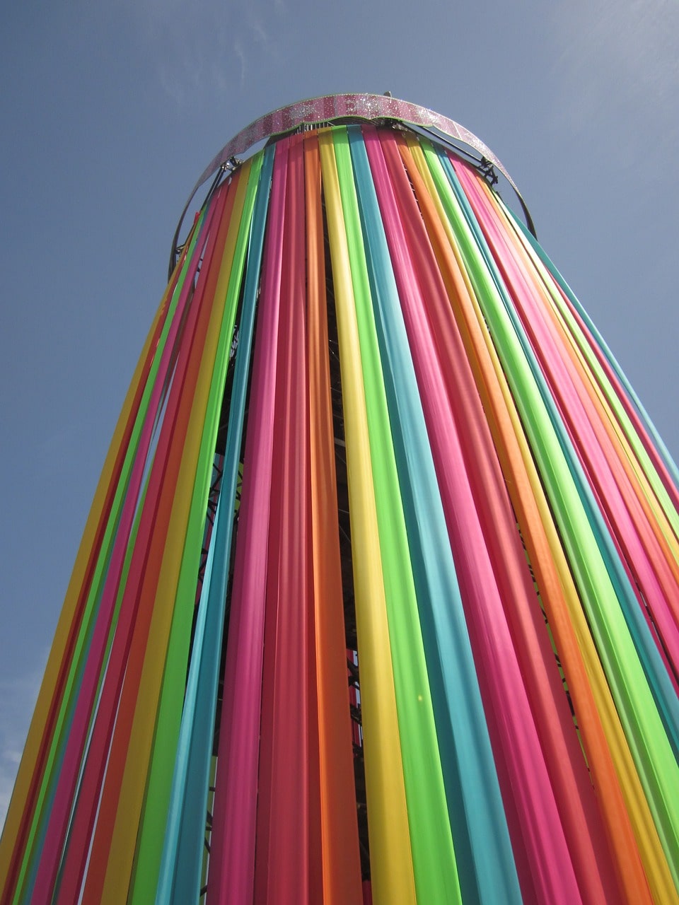 An image of the iconic rainbow flag tower at Glastonbury