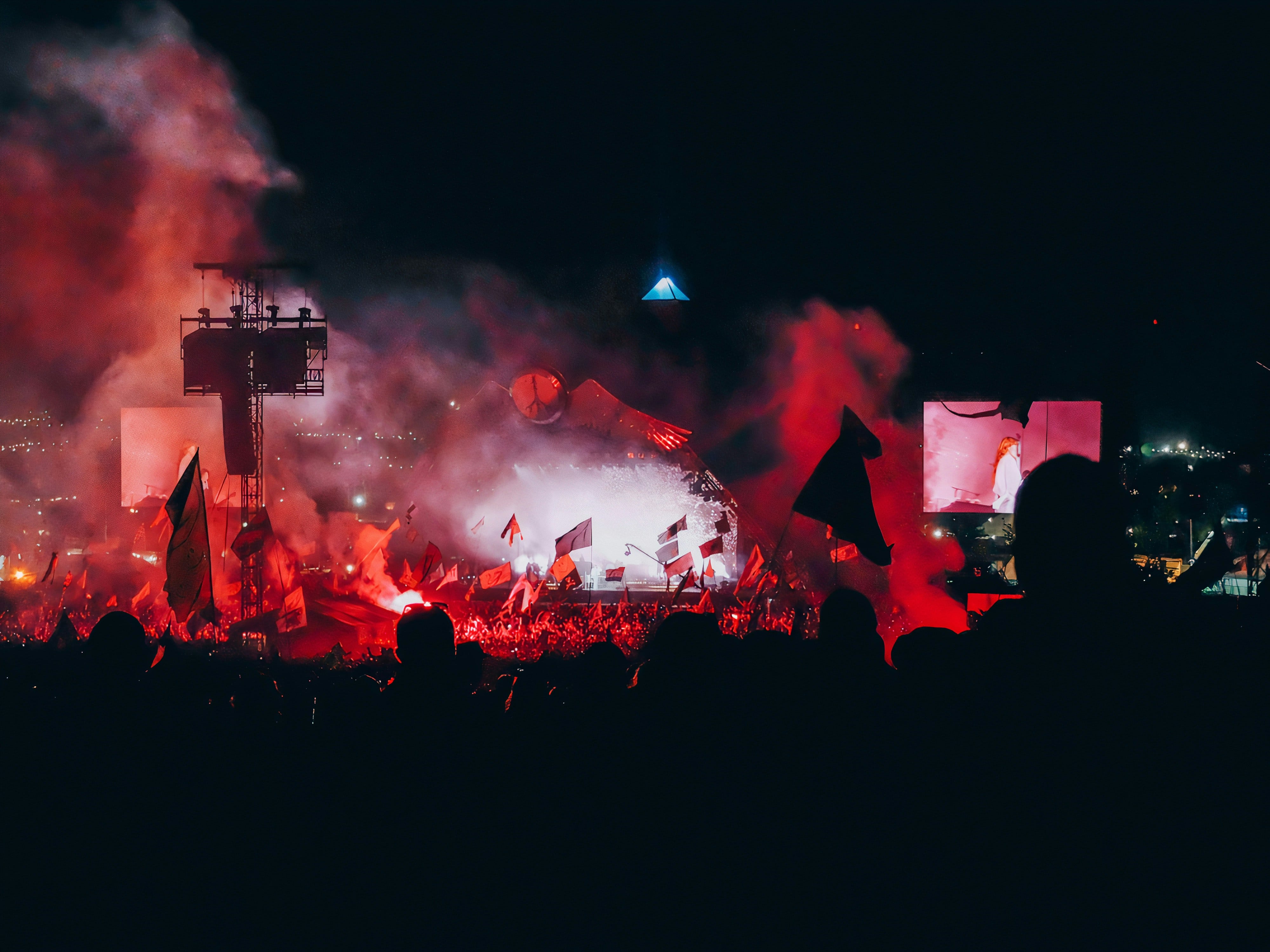 An image of the iconic Pyramid Stage at Glastonbury festival at night