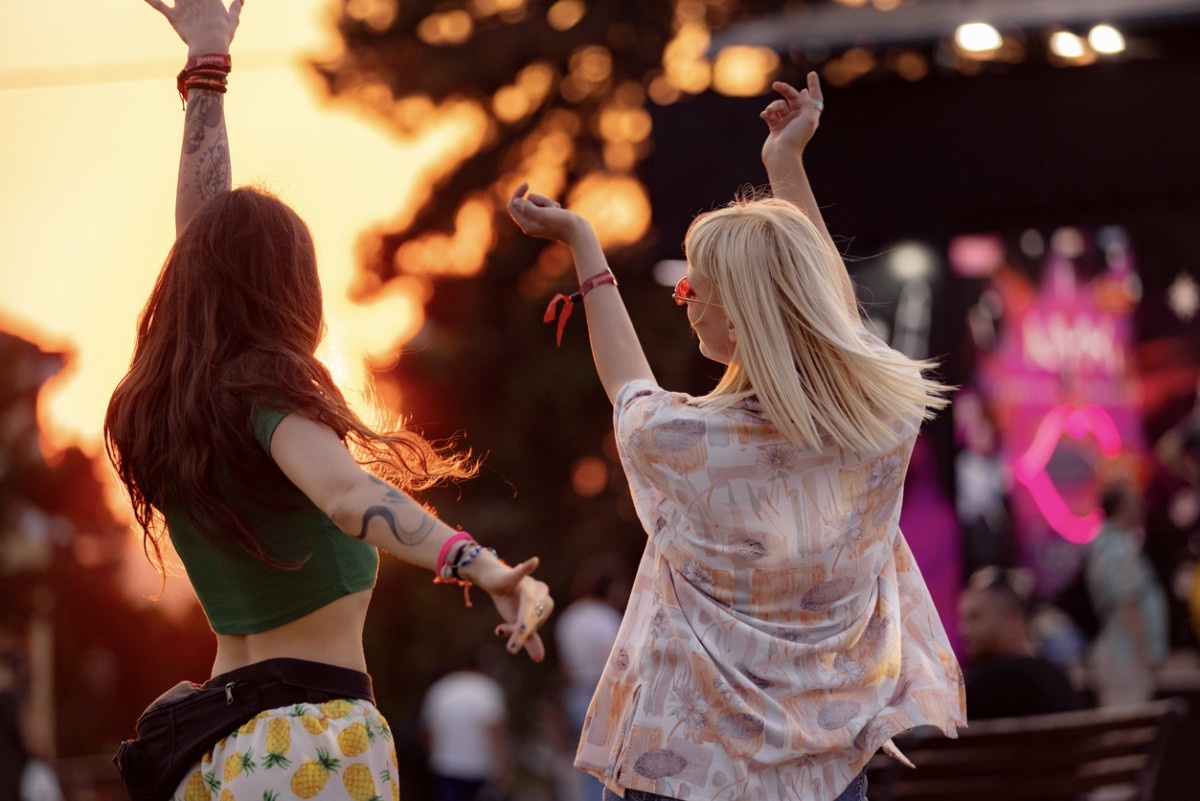 Two women dancing at Lindisfarne Festival