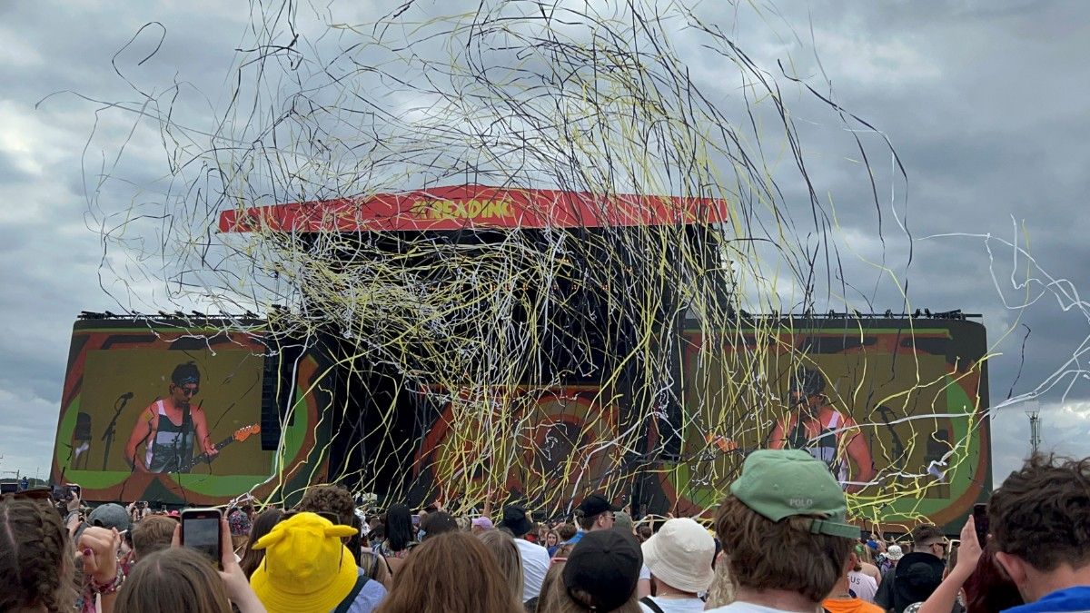 All Time Low playing at Reading Festival 2022 with streamers in front of the stage 