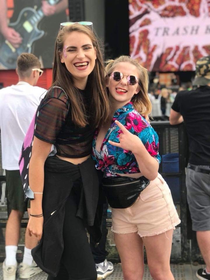 Two girls laughing at Reading Festival