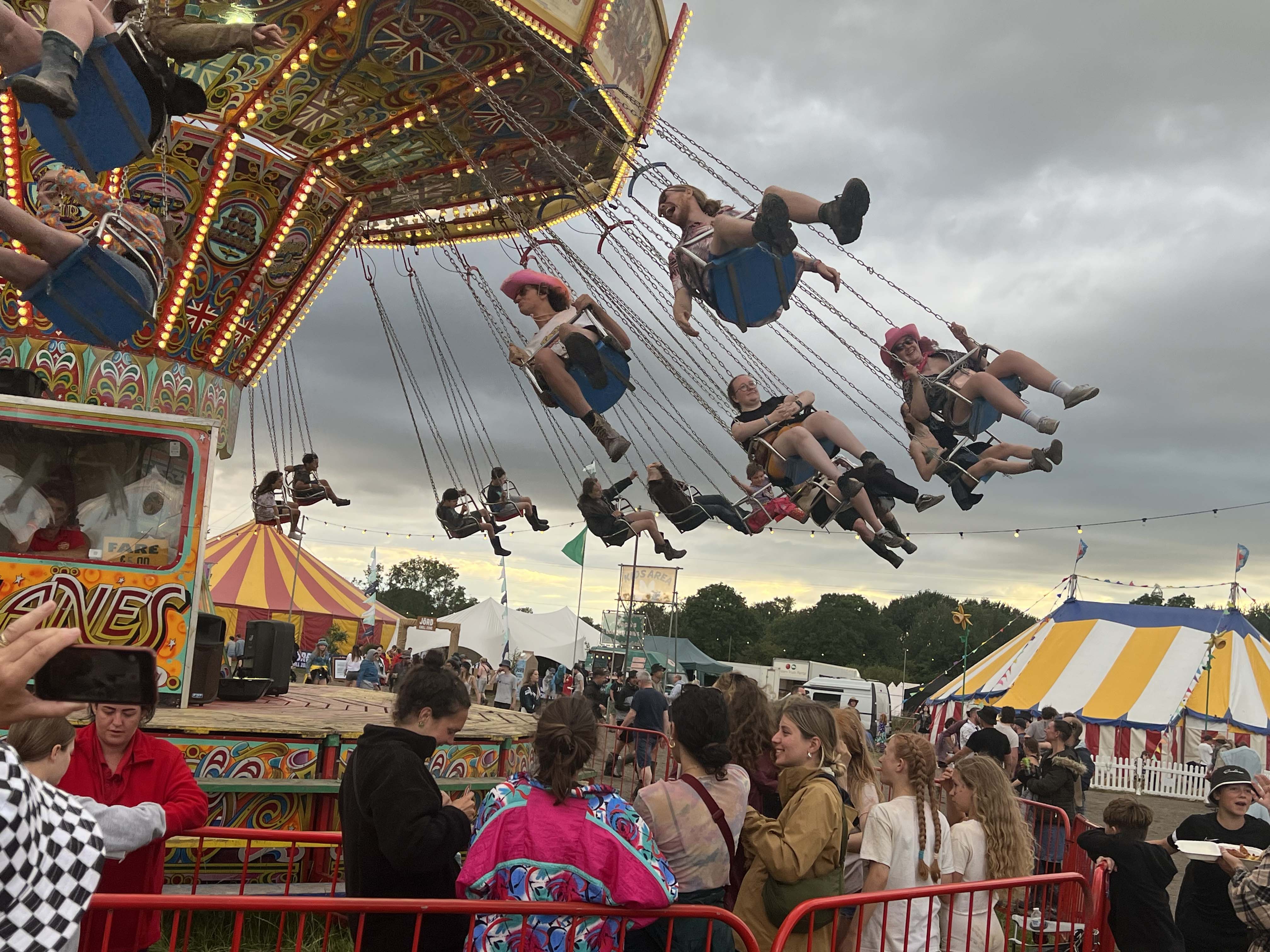 A group of people on a swing chair ride at Truck Festival 