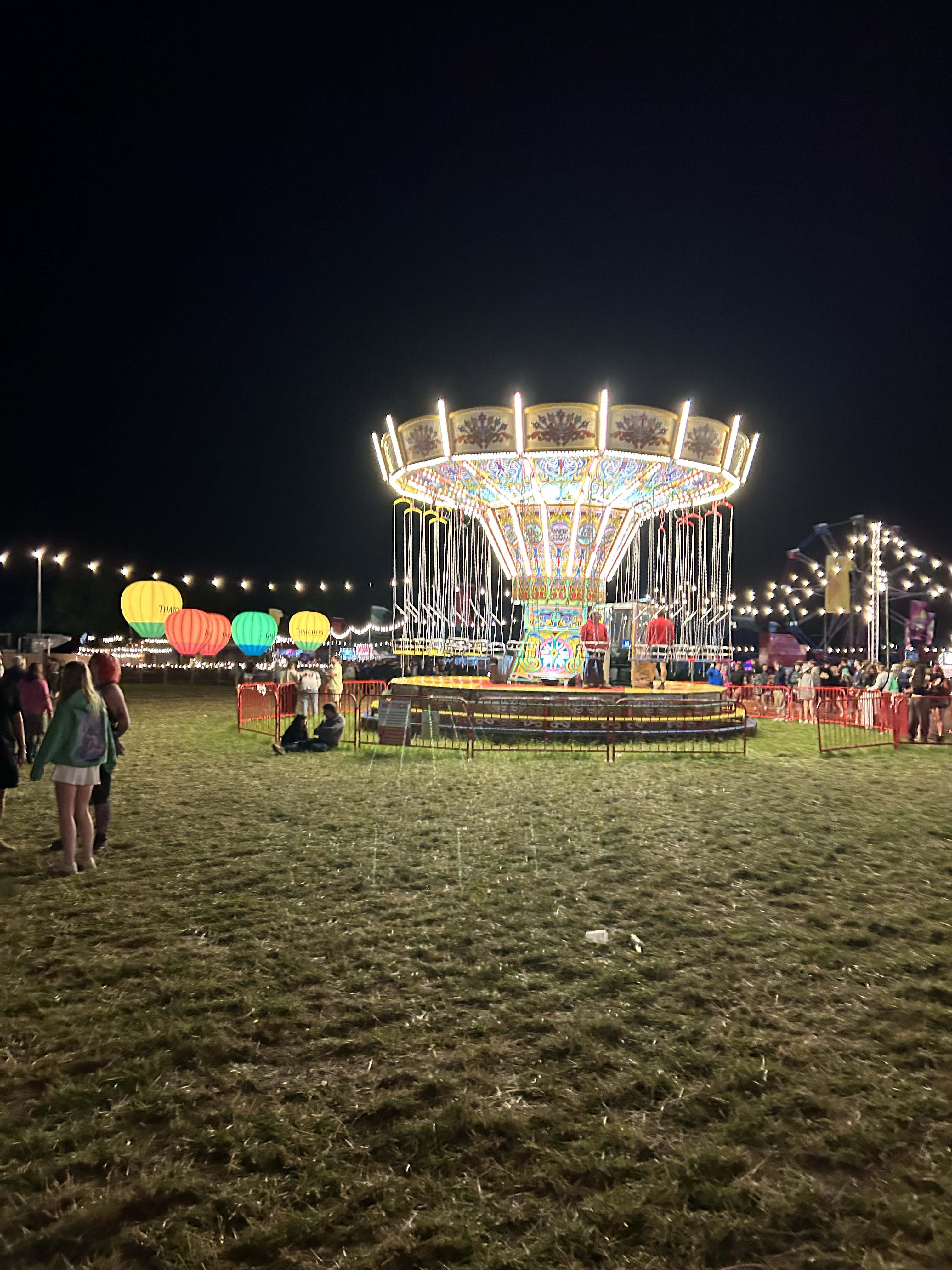 An image of the swing chair ride at Truck at nightime 