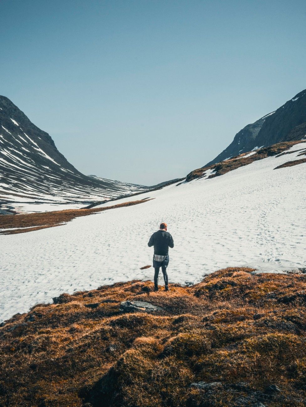 A person hiking in the snow on The Kungsleden Trail