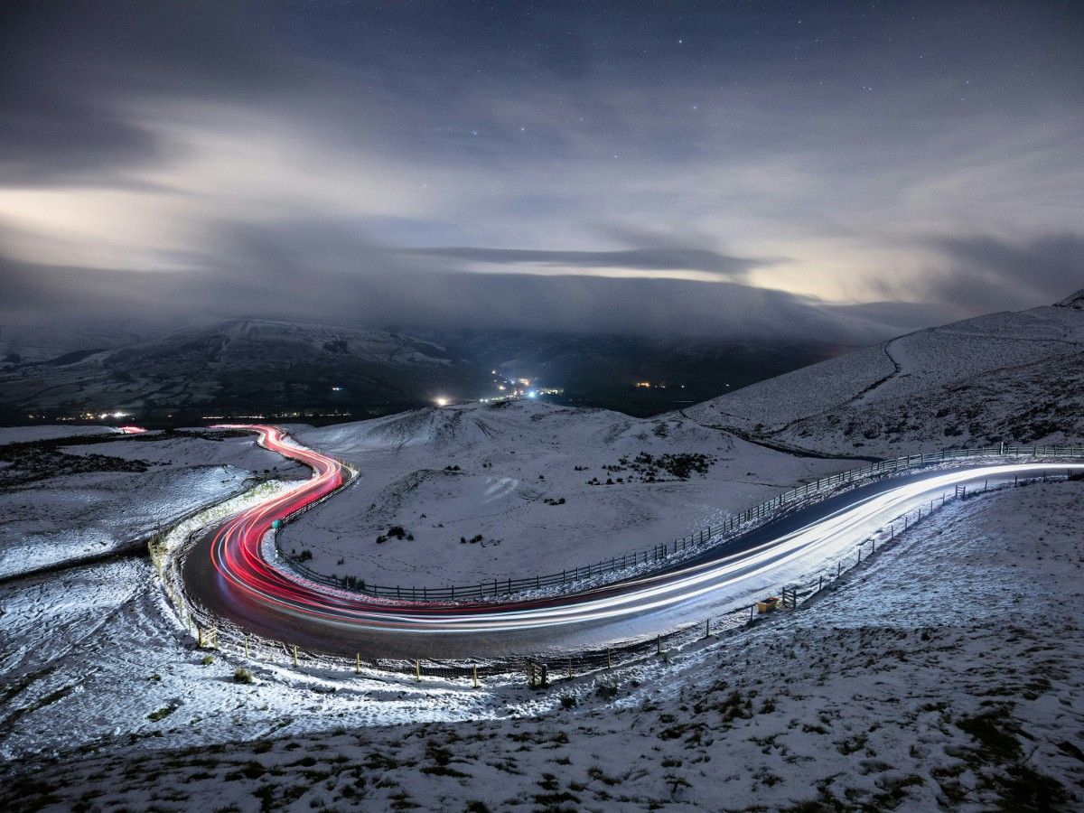 A road winding below Mam Tor in the snow