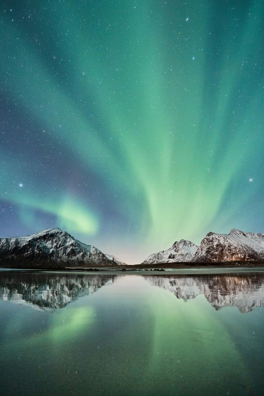 Aurora Borealis (The Northern Lights) over a mountain range