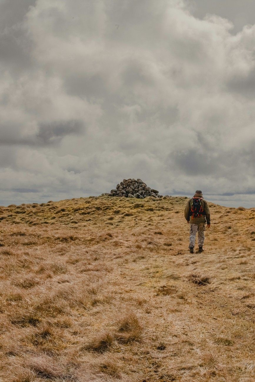 A man on a hill in Northumberland National Park 