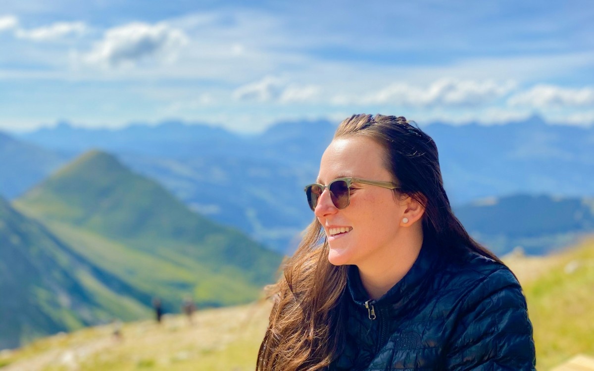 A woman smiling on the Tour du Mont Blanc