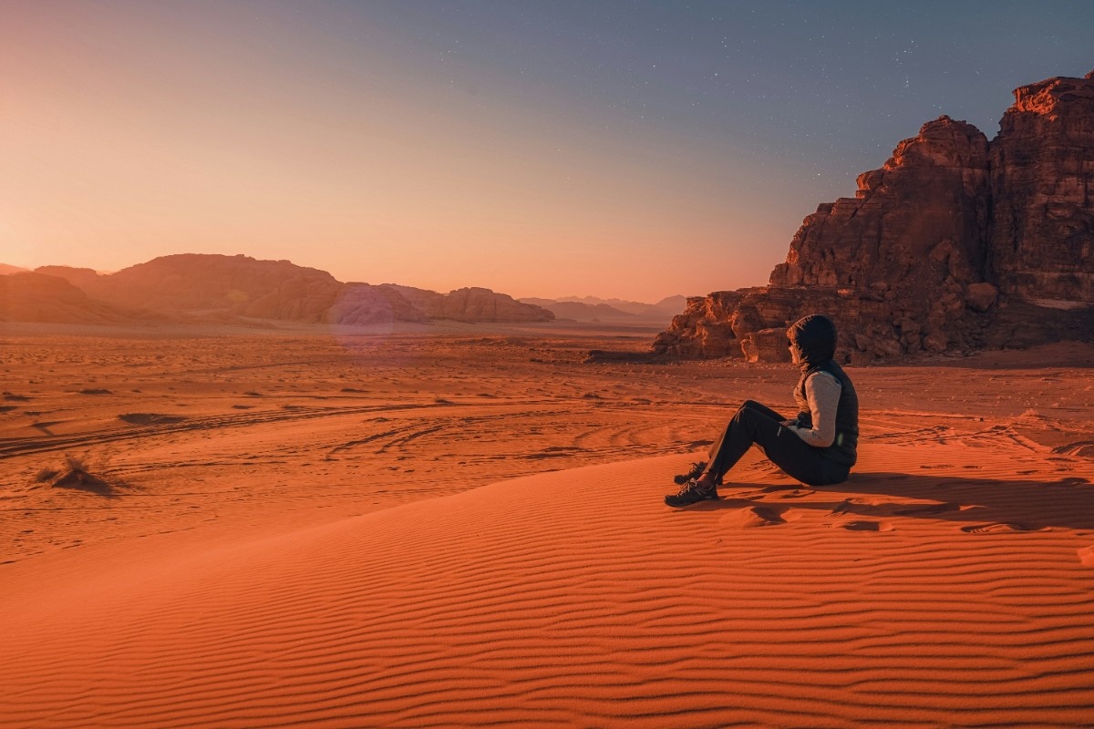 A person sat in Wadi Rum desert 