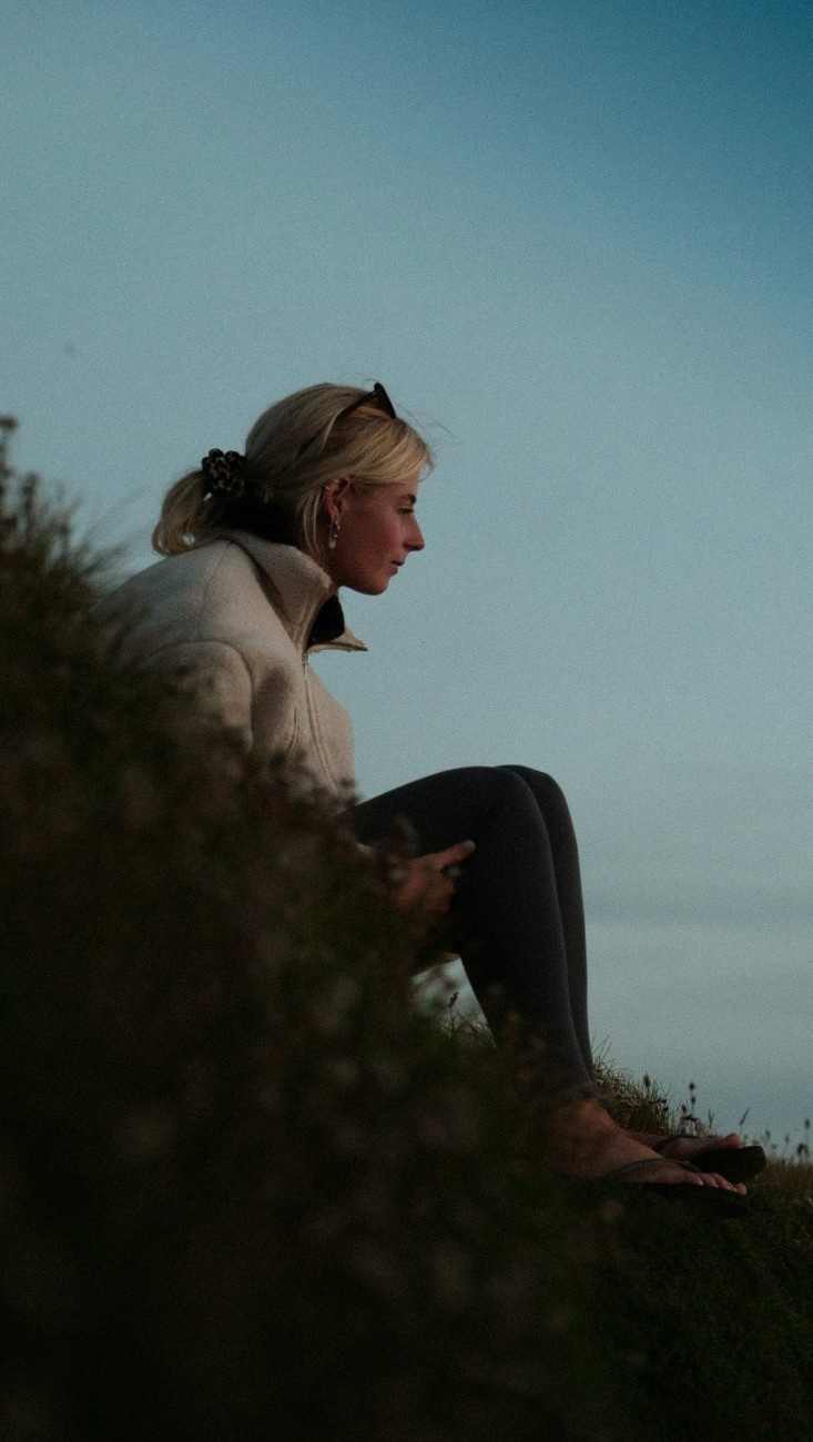 A woman looking out at watergate bay