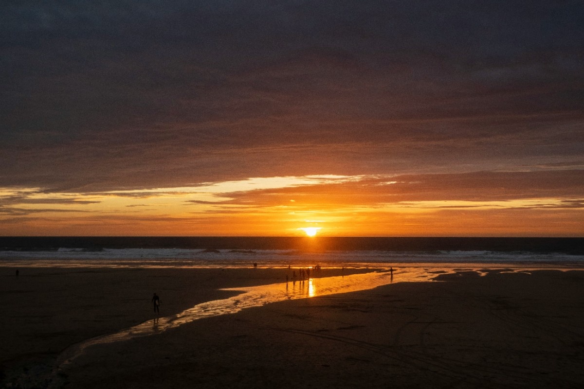 The sun setting over Watergate Bay