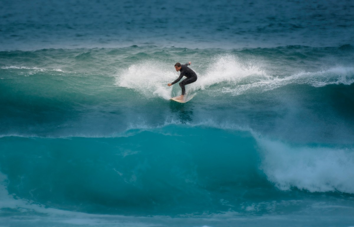 A surfer at Watergate Bay