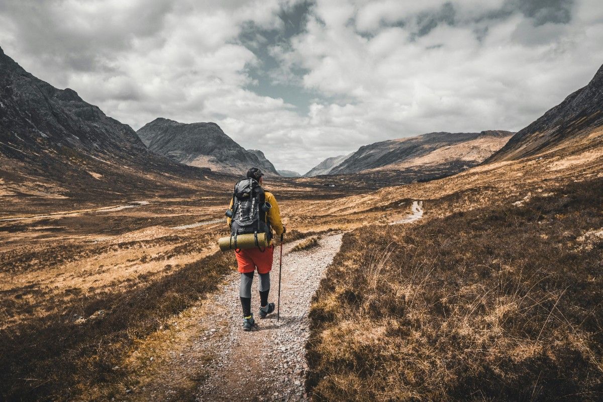 A hiker walking along the West Highlands Way