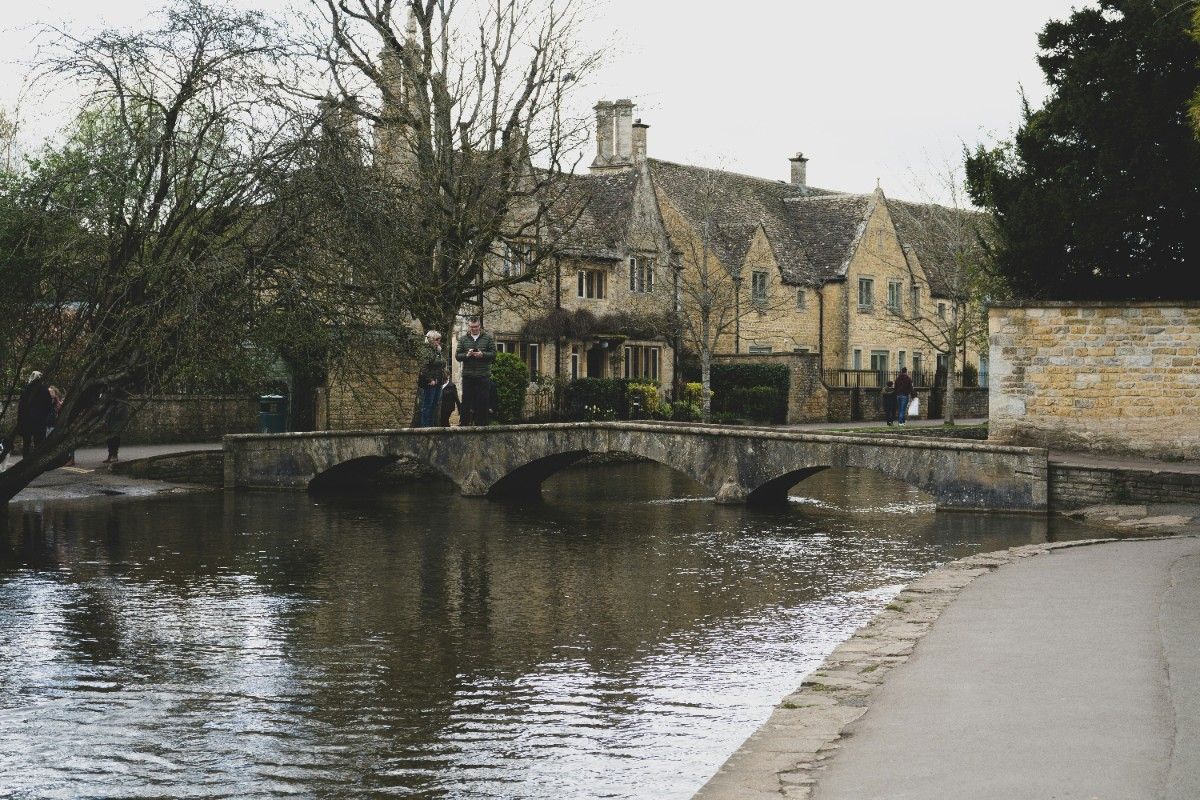 A pub and a bridge in Bourton on the Water by the river