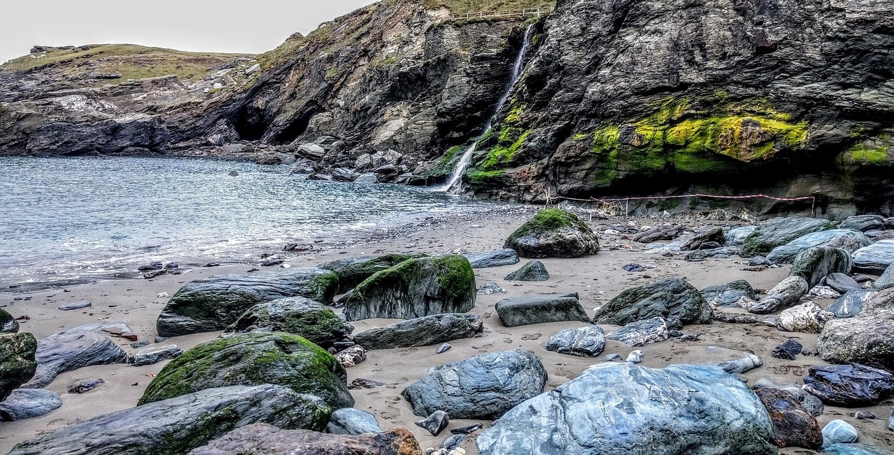 An image of a waterfall in Cornwall which goes into the sea