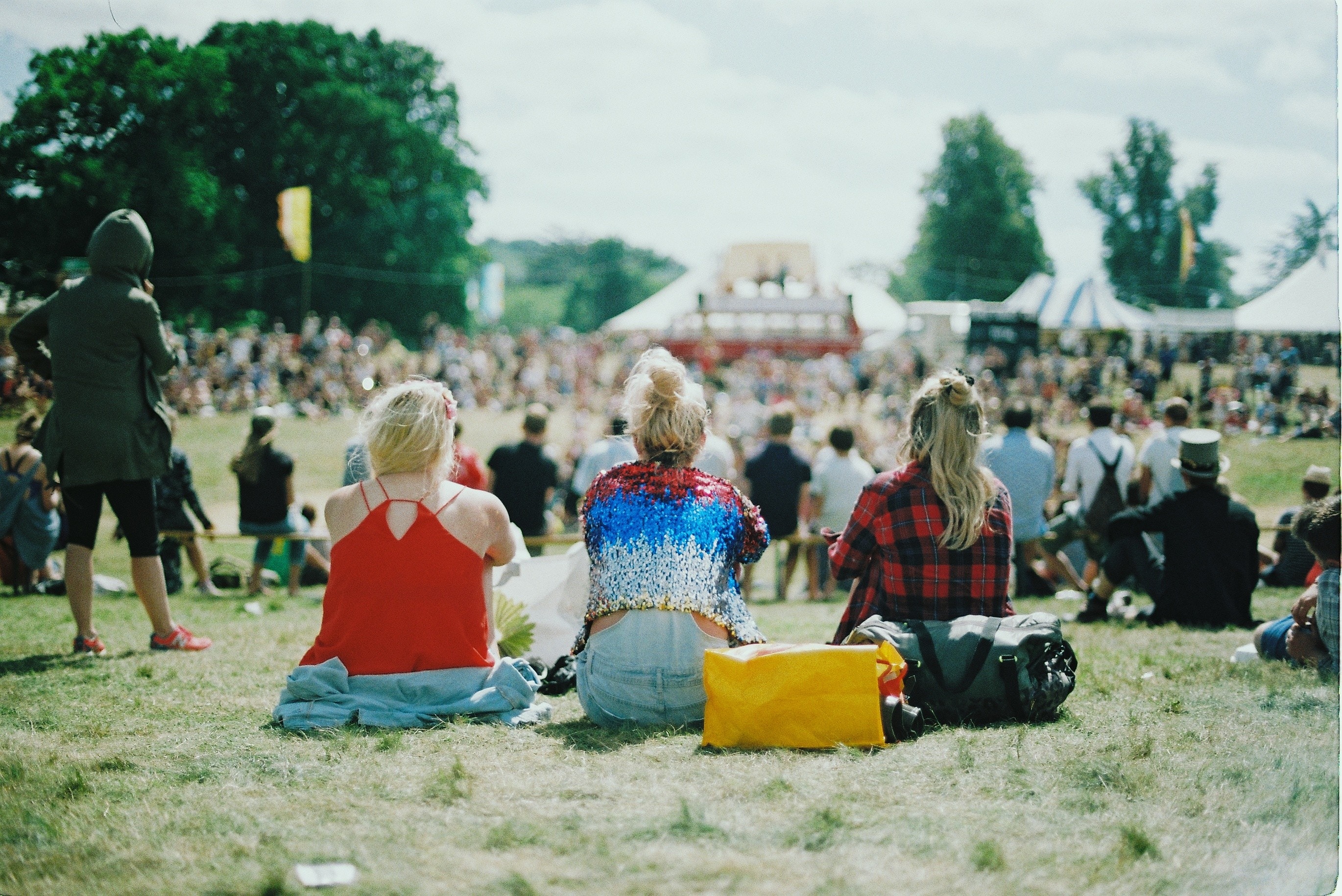 three women at a festival