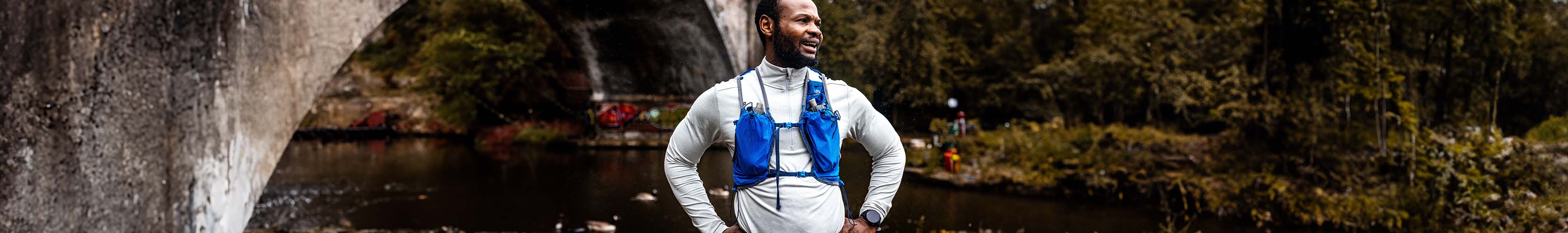 Shop accessories new season. Man resting after a run wearing a backpack